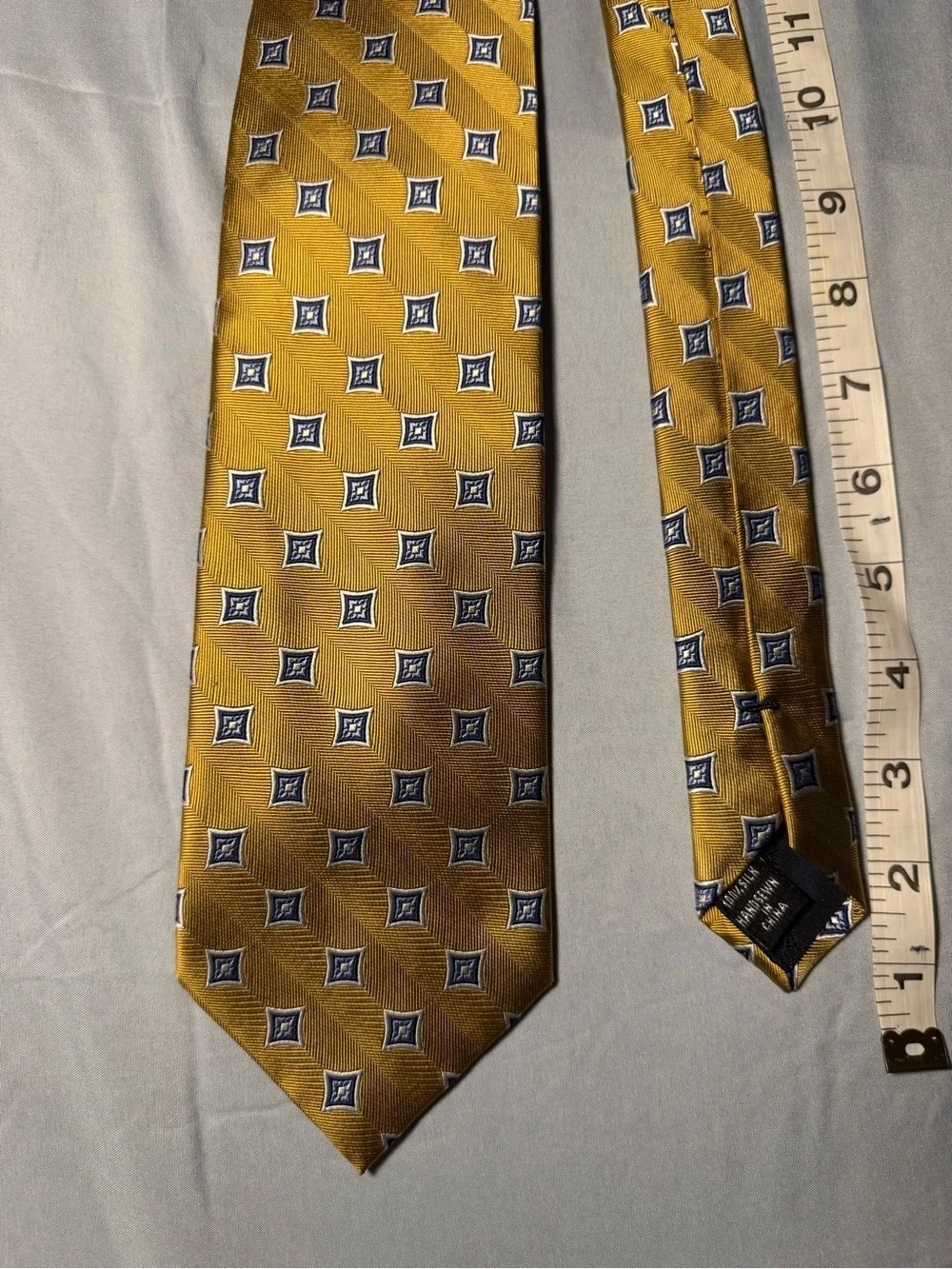 Jos. A. Bank Gold Tie with Navy Geometric Medallions